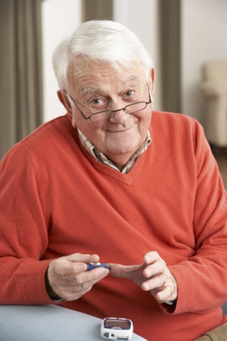 man taking diabetes blood test