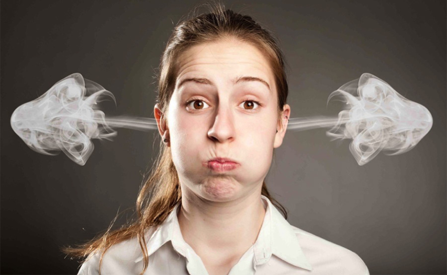 woman with smoke coming out of ears
