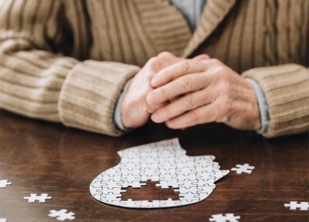 Hearing Loss and Dementia old person doing jigsaw