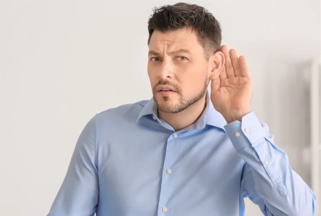 Sudden Hearing Loss- man with hand to ear