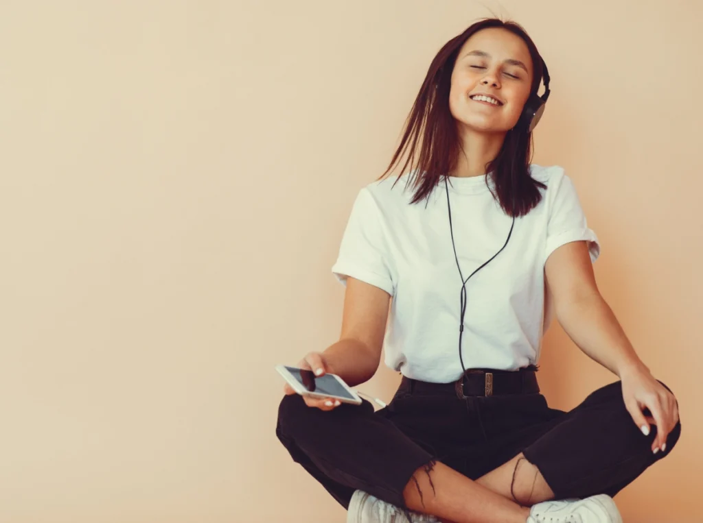 Woman listening to music-Why Looking After Your Hearing is Important_Blog Woman listening to music-Why Looking After Your Hearing is Important_Blog